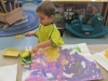 Kayden adding sponge prints to his painting